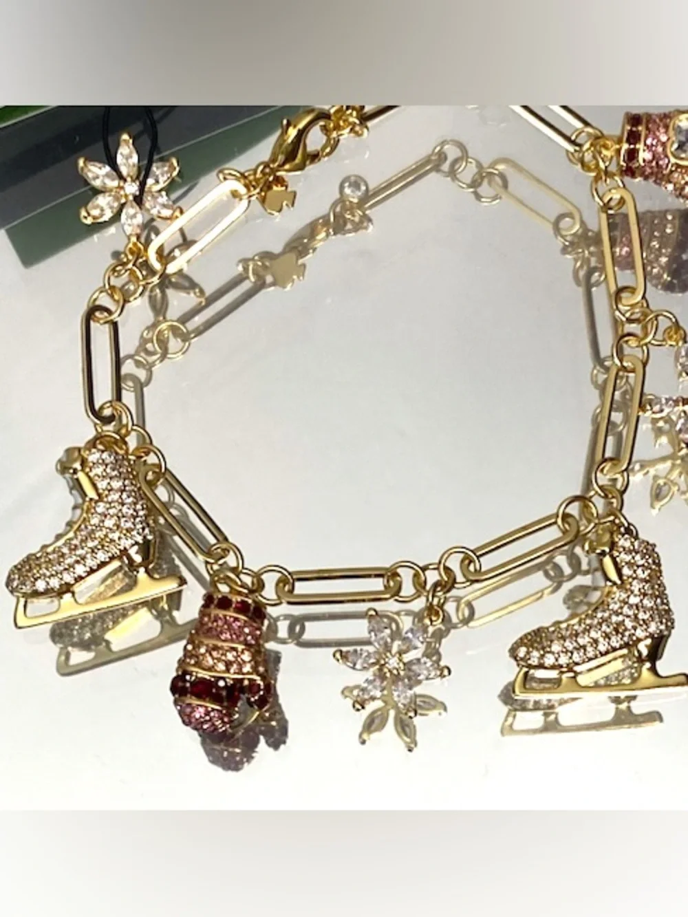 kate spade Gold-Tone Ice Skate & Snowflake Charm Bracelet with Pink Accents - Picture 5 of 9